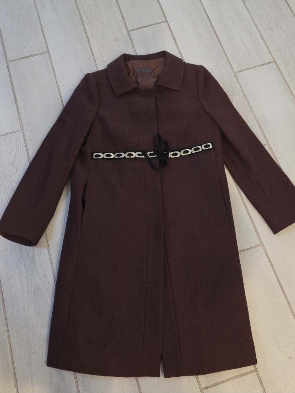 Alberta Ferretti brown wool coat with a chain belt detail.